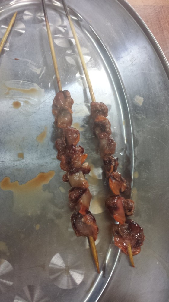 raw cockles on a skewer