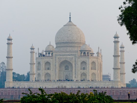 setting sun casts its light from the right from across the Yamuna