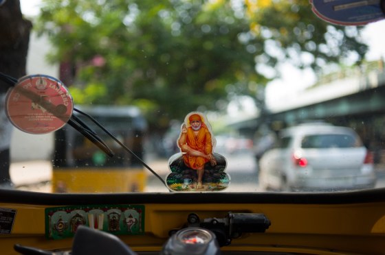 holy man image on the tuktuk screen...