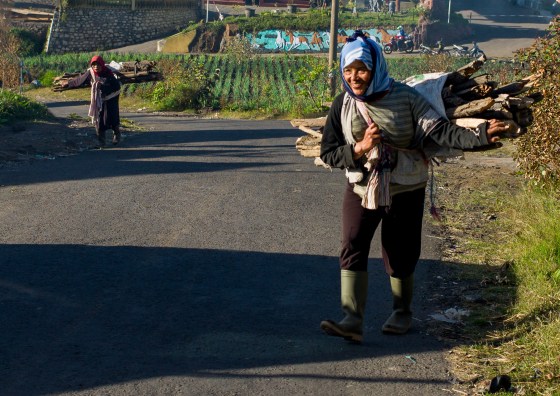 local ladies carrying firewood