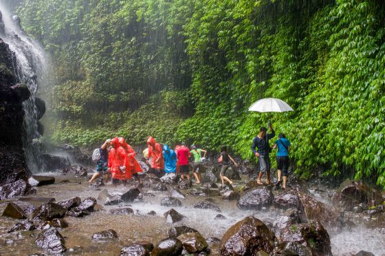 the part where an arc of waterfalls sprays onto visitors below