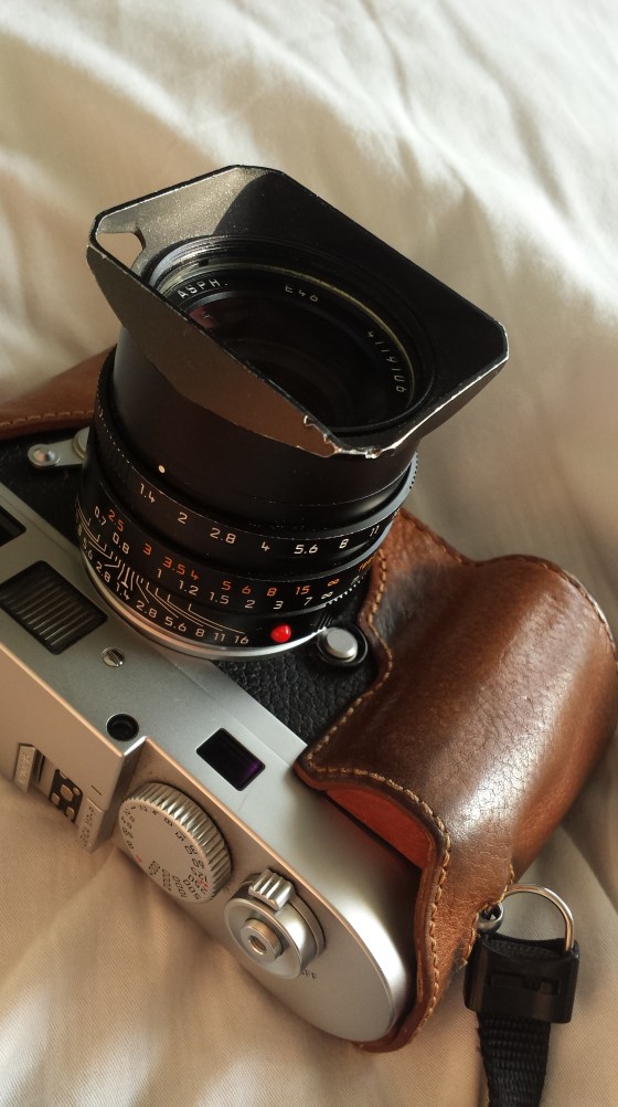 my trusty Leica M9P such as it is today, dented hood and all