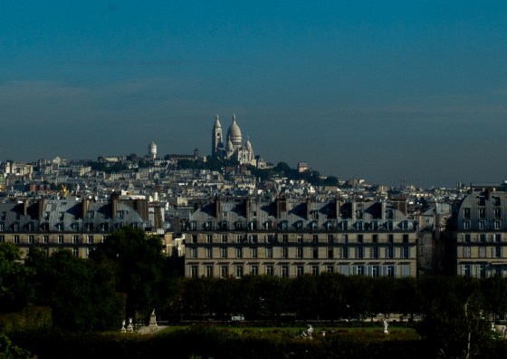 view of the Sacre Coeur church on the hill in Montmartre as seen from Musee d'Orsay